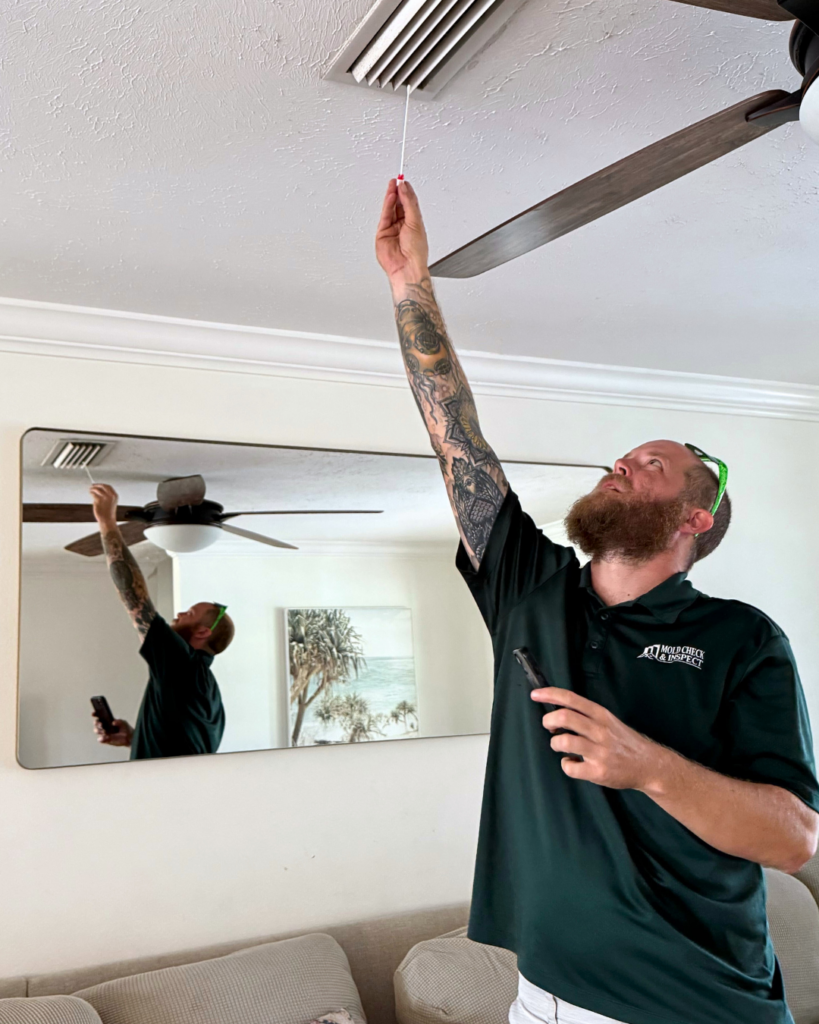 Home inspector conducting swab sampling to determine organic growth in an ac vent. This will identify if and what type of mold is present.