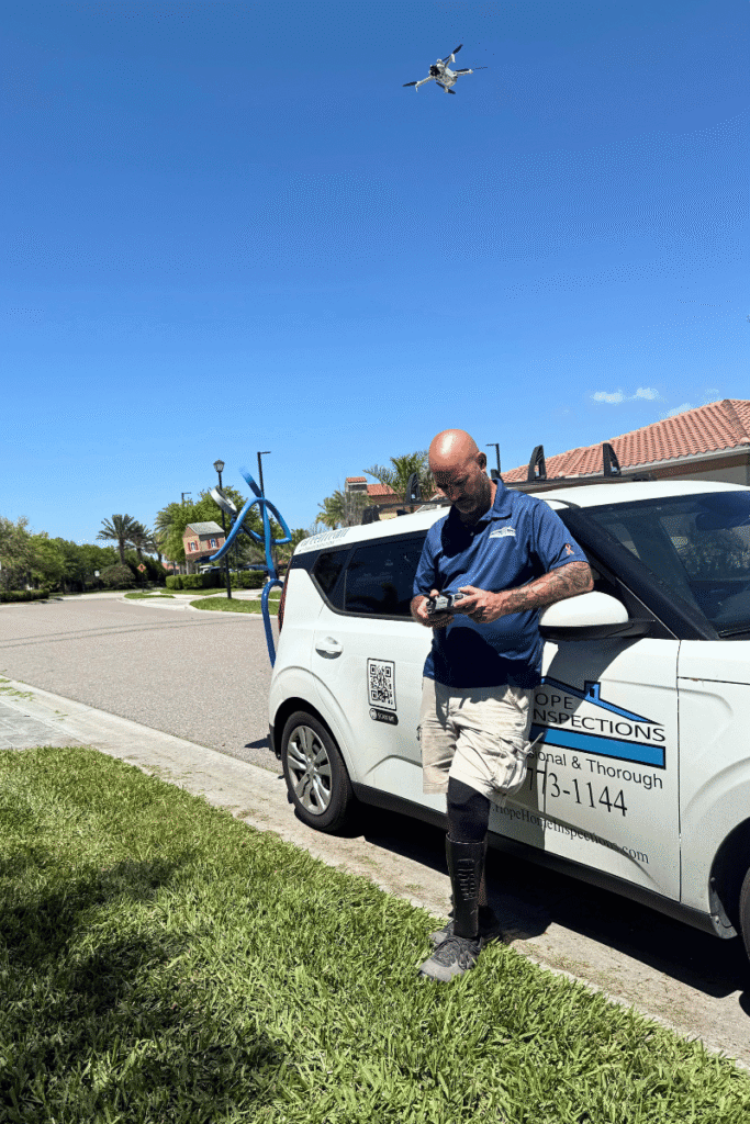 Commercial inspection flying a drone to inspect the roof