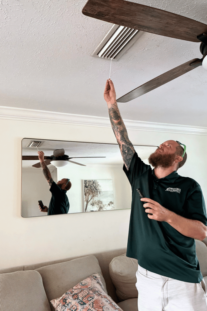 Home inspector swabbing an AC vent for mold