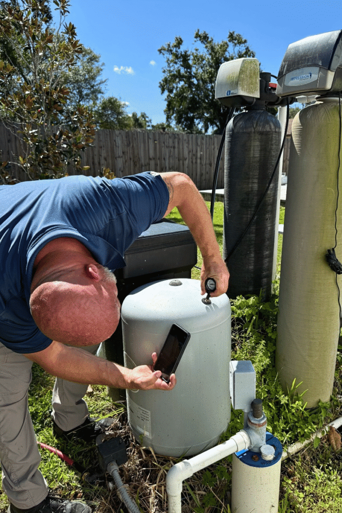 Home inspector testing well components 